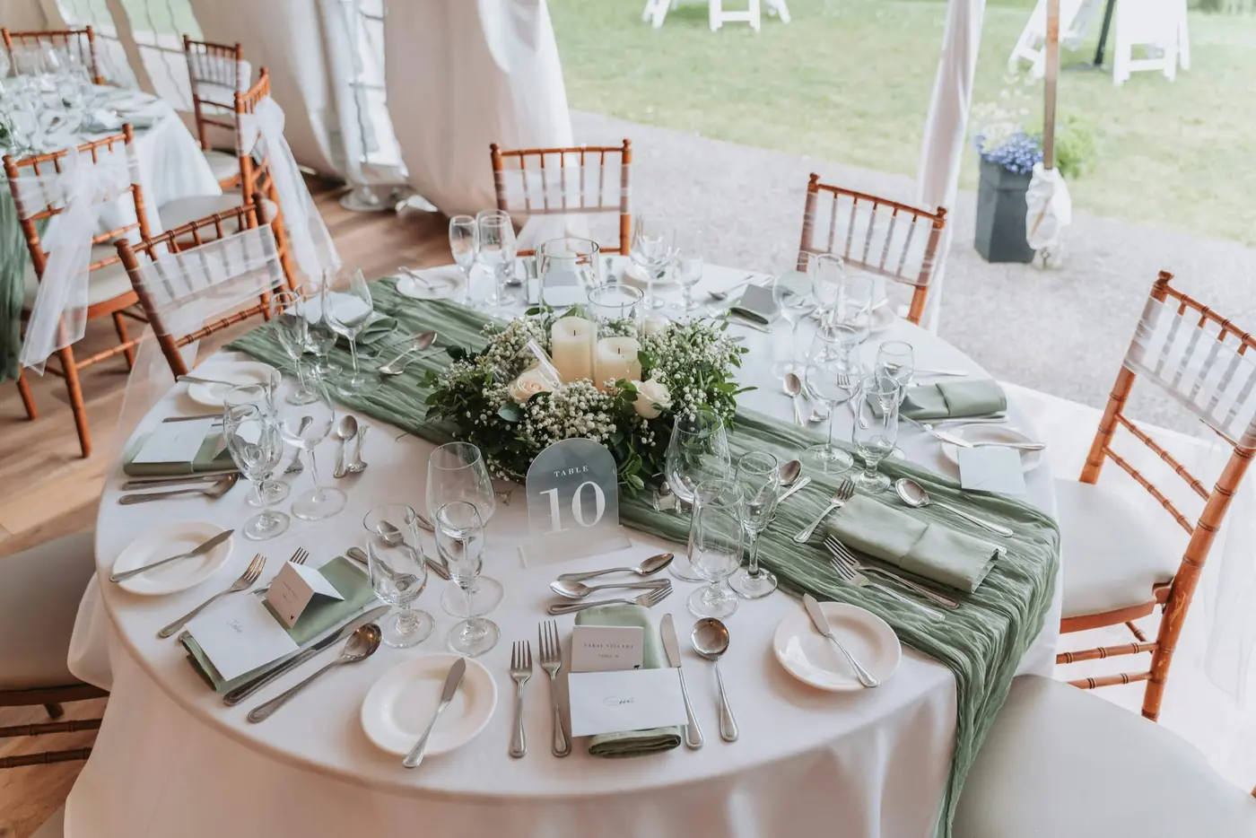 Round event table setup with styled centerpiece and tableware